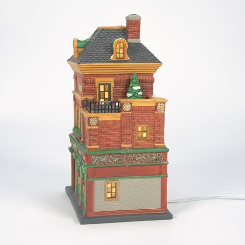 Decorative model of a two-story building with a small tree on a white background